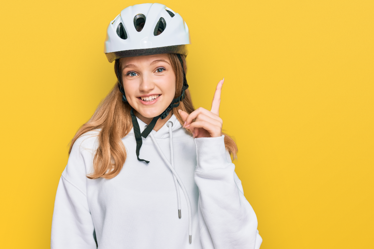 Young girl wearing a dorky e-bike helmet