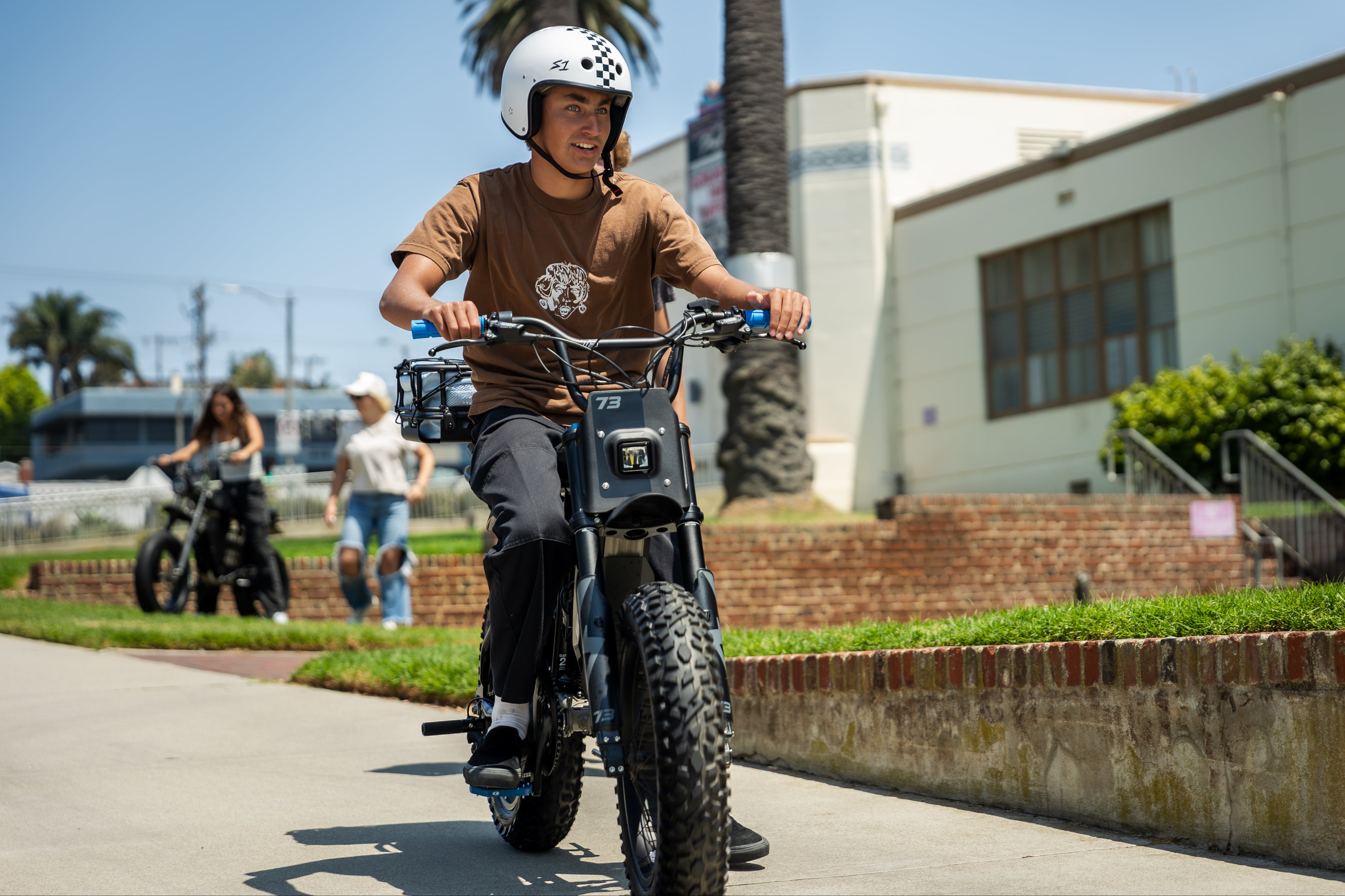 Teenager on E-bike Outside of His School